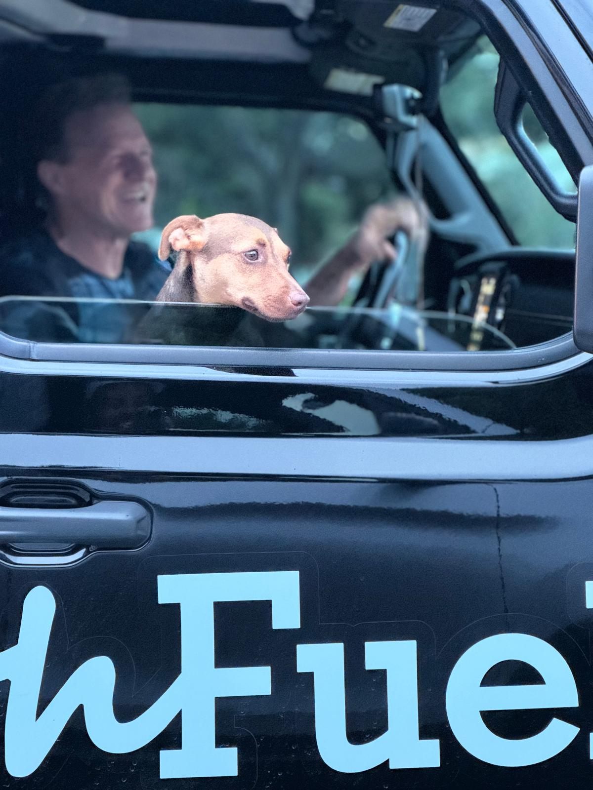 Zilla and TY in the Jeep